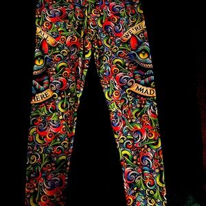 These are custom made Cheshire Cat Alice in Wonderland leggings.